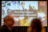 Nicole, wearing a King's College London staff lanyard, smiling mid-conversation with Anica, whose back is to the camera, at the summit event.