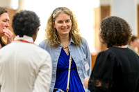 Anica smiling in conversation with Katharina, Nicole, and 'Funmi, all attendees gathered in a small group at the summit.