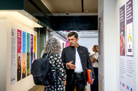 Professor Shitij visits the One King’s Impact exhibition and reads all information about the funded projects. He is being guided by Melanie Abas.